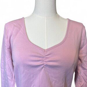 pink long sleeve top with ruched detail